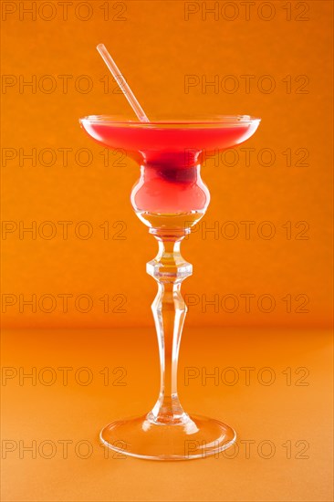 Scofflaw cocktail on orange background