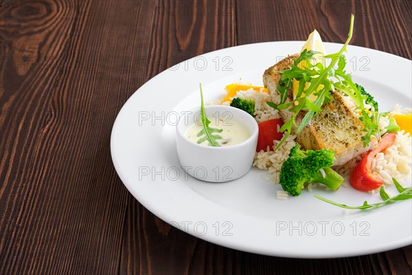 Closeup view of fried zander with rice