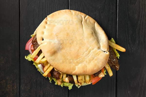 Top view of pitta bread stuffed with salad