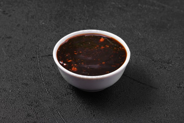 Small bowl with spicy teriyaki sauce