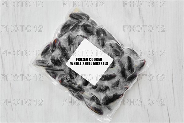 Frozen cooked whole shell mussels in package