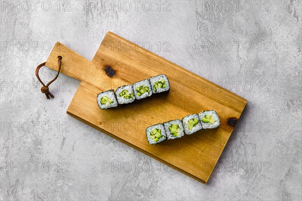 Top view of small rolls with cucumber