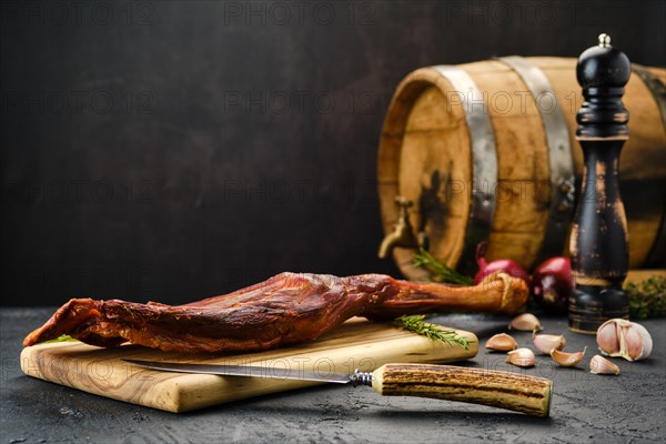 Air dried lamb meat on wooden cutting board