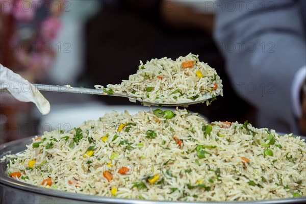 Cantonese style fried rice in a large bowl at a wedding reception