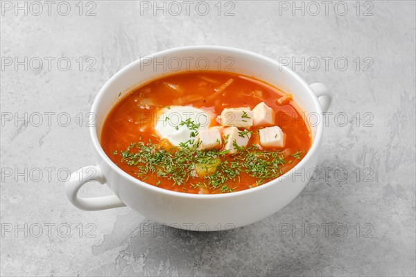 Tomato soup with chicken meat and sour cream