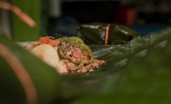 Nacatamal ingredients on banana leaves