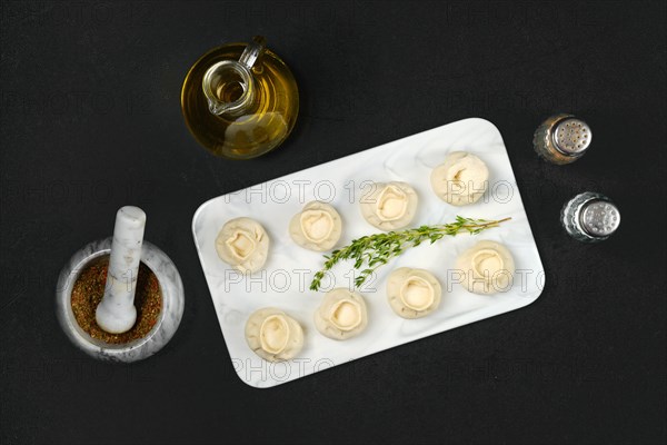 Top view of frozen dumplings with turkey and tarragon