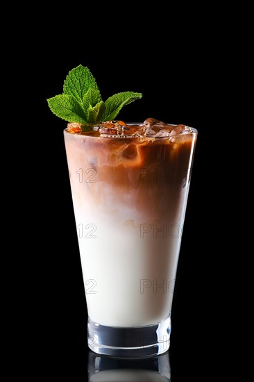 Glass of coffee with ice and cream isolated on black background