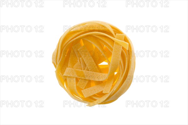 Top view of nest noodles isolated on white background. Italian tagliatelle with egg