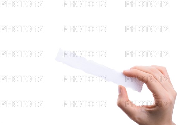 Hand holding a piece of blank torn notepaper