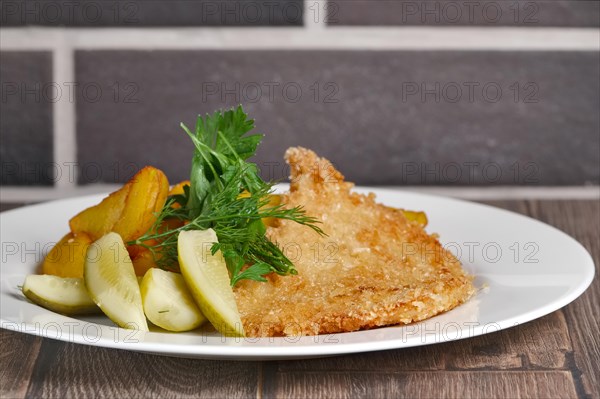 Chicken entrecote with potato and salty cucumber