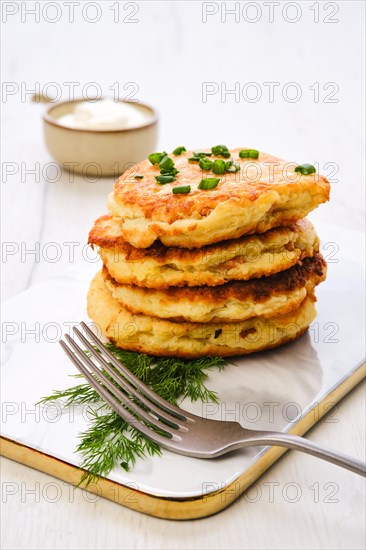 Potato pancakes stuffed with chopped salmon meat