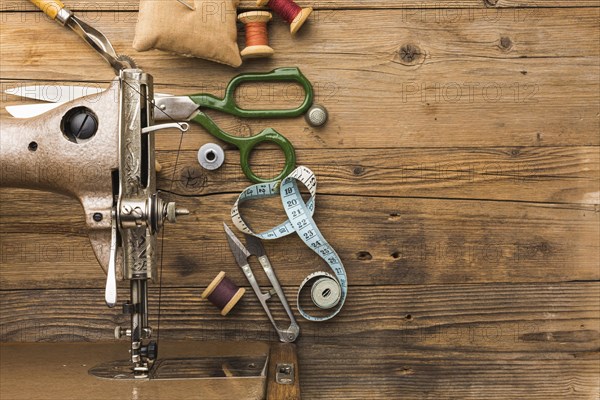 Top view of vintage sewing machine with scissors and thread. Resolution and high quality beautiful photo