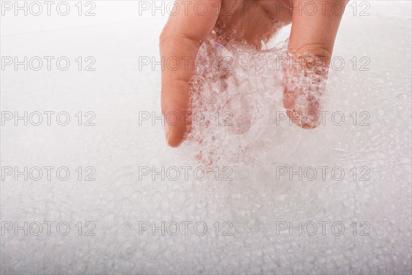 Hand washing and soap foam on a foamy background