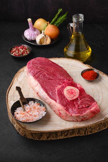 Raw chuck eye steak on kitchen table ready for cooking