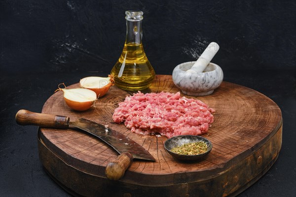 Making fresh raw beef mince meat with chopping knife