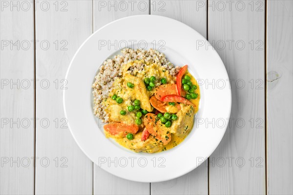 Overhead view of beef stew with carrot