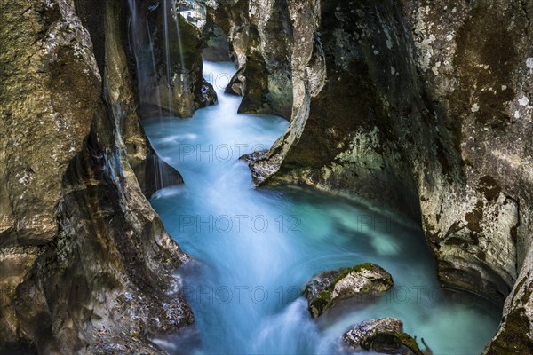 Mountain river Soca flows through narrow canyon