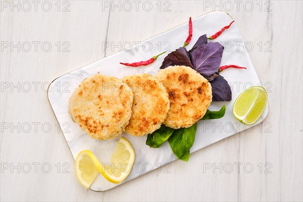 Top view of potato pancakes stuffed with chopped trout