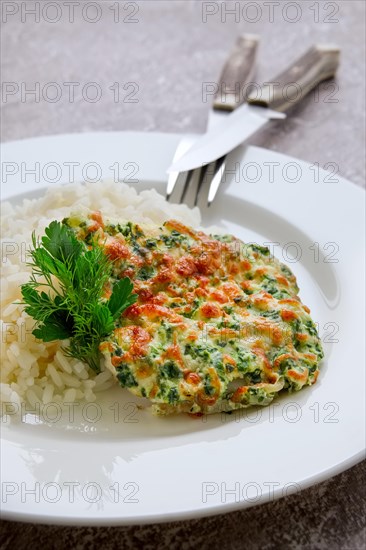 Fried hake fillet with spinach