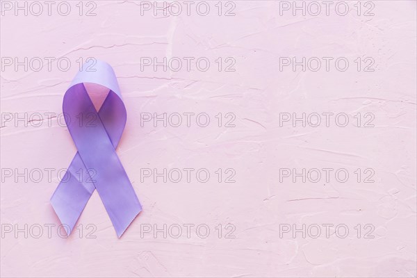 Epilepsy awareness symbol pink backdrop