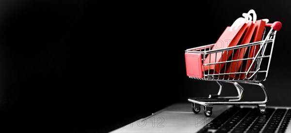 Front view cyber monday shopping cart with bags copy space