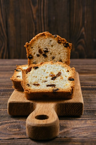 Fresh biscuit cake with raisins on the table closeup