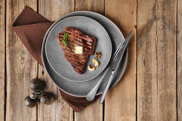 Overhead view of beef steak on a plate