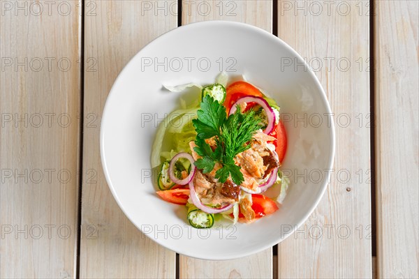 Top view of salad with salmon