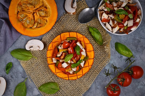 Top view of vegan baked Red Hokkaido squash vegetable filled with bell pepper