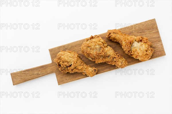 Top view fried chicken drumsticks cutting board. Resolution and high quality beautiful photo