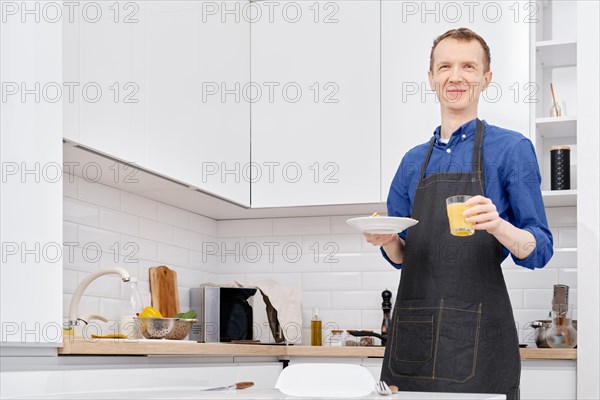 Middle aged man is going to have his healthy breakfast at home