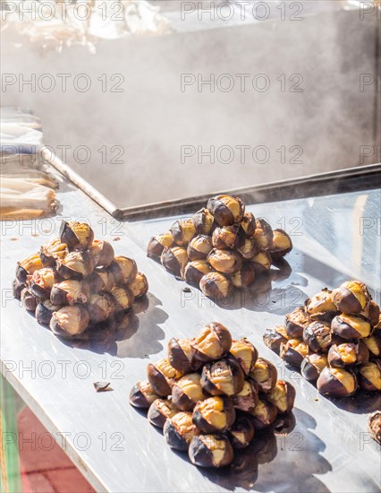 Organic brown chestnuts roasted over a hot fire