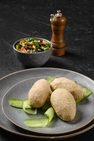 Semifinished frozen cepelinai. Potato dumplings stuffed with ground meat