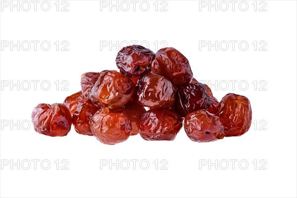 Heap of dry date fruit isolated on white background