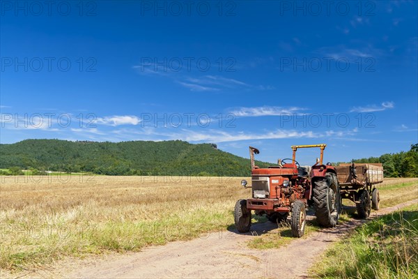 Old tractor on a field path