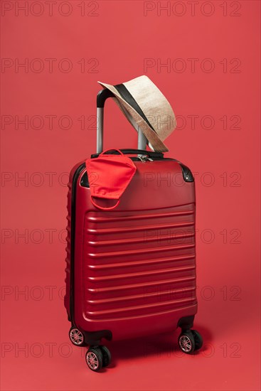 Red luggage with hat mask. Resolution and high quality beautiful photo