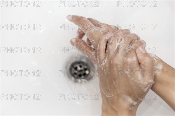 Top view person washing hands with soap. Resolution and high quality beautiful photo