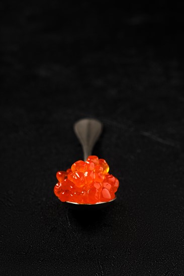 Spoon with salmon red caviar