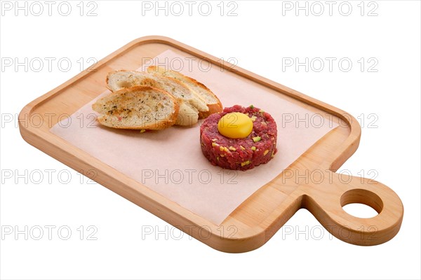 Classic steak tartare with egg and garlic bread