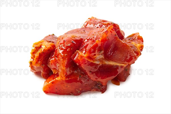 Raw piece of meat with spice and sauce prepered for barbecue. Gastronomy template isolated on white background