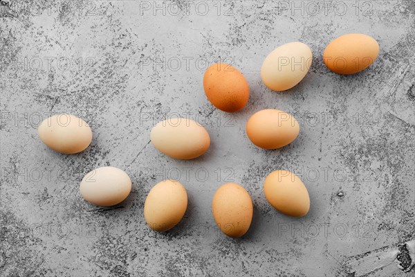 Fresh country eggs scattered on table