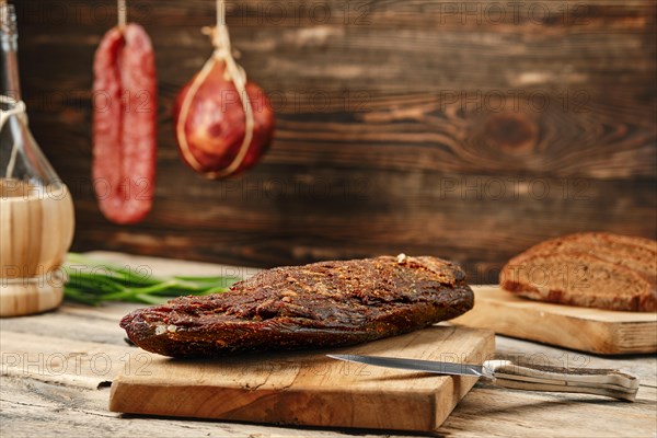 Air dried beef meat on wooden cutting board