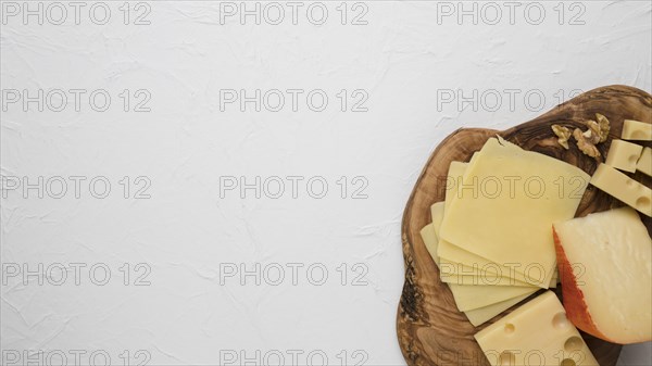 Cheese plate served with walnut isolated white