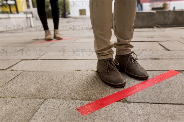 Woman queue outdoors with tape. Resolution and high quality beautiful photo