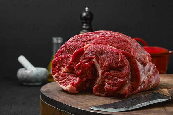 Closeup view of raw beef neck with thyme