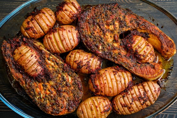 Baked salmon steak with hasselback potatoes