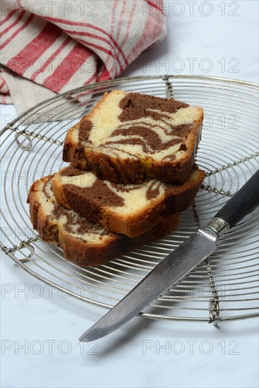 Marble cake and knife on cake rack