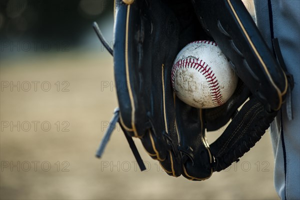 Close up baseball held glove