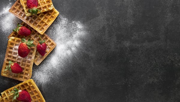 Top view waffles with powdered sugar strawberries. Resolution and high quality beautiful photo